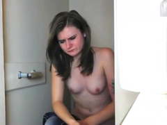 Hidden cam  - Brunette struggling on the toilet